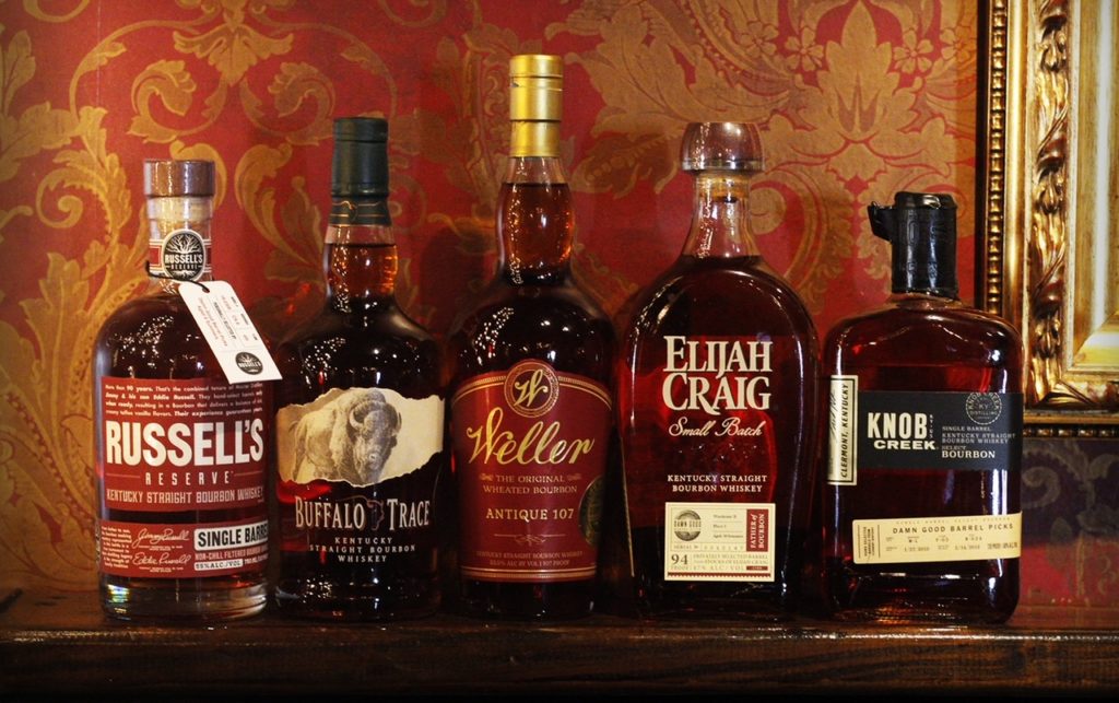 A row of Damn Good Hospitality Barrel Pick Bourbons