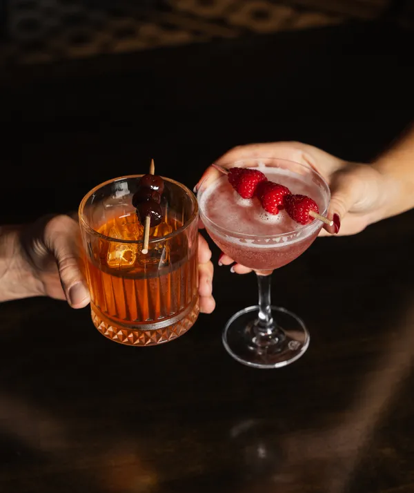 Enjoy "his and her" libations on Valentine's Day with a Manhattan and a a French Martini at Warren Delray